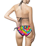A vibrant and colorful PLUR Smiles Rave Bikini, featuring a tie-dye design with rainbow smileys, perfect for rave and EDM festival enthusiasts. Made from 85% polyester and 15% spandex, this two-piece swimsuit offers a light, comfortable fit with fade-resistant properties and elastic straps, ideal for showcasing personal style at any beach rave or pool party.