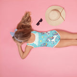 Unicorn Dreamscape one-piece girls' swimsuit featuring a magical array of pastel colors and whimsical unicorn patterns. Perfect for young rave enthusiasts and festival-goers, this swimsuit combines comfort and style with a touch of fantasy, ideal for making a splash at any pool party or beach rave.