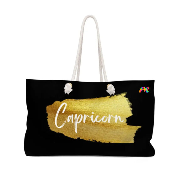 large black weekender bag with rope handles, lined on the inside, Capricorn written on the side in a gold paint brush stroke, Capricorn Weekender Bag - Cosplay Moon