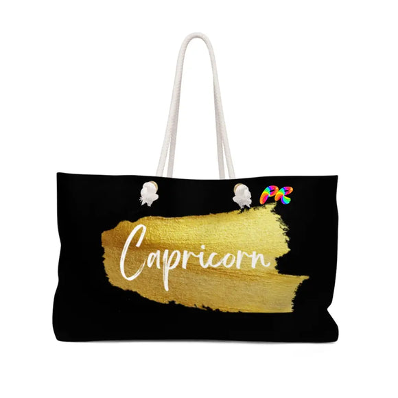 large black weekender bag with rope handles, lined on the inside, Capricorn written on the side in a gold paint brush stroke, Capricorn Weekender Bag - Cosplay Moon