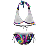 Cosmic Dance Plus Size Rave Bikini adorned with a galaxy planet design in shades of purples, blacks, pinks, and blues. This swimsuit features wide straps, a low-waist triangle bikini top with adjustable neck and middle back ties, and side-tie adjustments on the swim trunks, tailored for a comfortable and stylish experience at any rave or festival event.