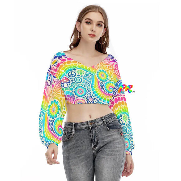 A vibrant and colorful Garden Long Sleeve Rave Crop Top featuring a psychedelic rainbow pattern. This stylish top is designed with loose, flowing long sleeves, perfect for making a bold statement at any rave or festival. Xs / White