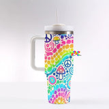 Colorful Garden Rave 40 oz Tumbler with handle, featuring a leak-proof silicone lid, reusable straw, and durable stainless steel construction. Perfect gifts for ravers to carry at festivals, and staying hydrated on the go.