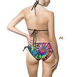 Eye-catching Happy Vibes Rave String Bikini from Prism Raves, featuring a vivid, multicolored pattern ideal for festival fashion. Adjustable neck, back, and side ties ensure a customizable and secure fit, crafted from soft, durable fabric for comfort and resilience in any rave or beach setting.