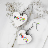Natural-colored PLUR Wooden Heart-Shaped Earrings available on Prism Raves website, featuring 'Peace, Love, Unity, Respect' engraving, lightweight design, hypoallergenic material, copper-plated hooks, and dimensions suitable for comfortable wear at raves and festivals.