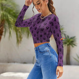crew neck, long sleeve, cropped shirt with an adjustable tie in the back at the waist. comes to navel and has a purple background with a skull pattern sizes small to 2XL, 90% polyester + 10% spandex (90% Polyester + 10% spandex) Women's/Female Long Sleeve Crew Neck Backless Adjustable tie in back Shirt Goth Purple Skull Backless T-shirt - Cosplay Moon